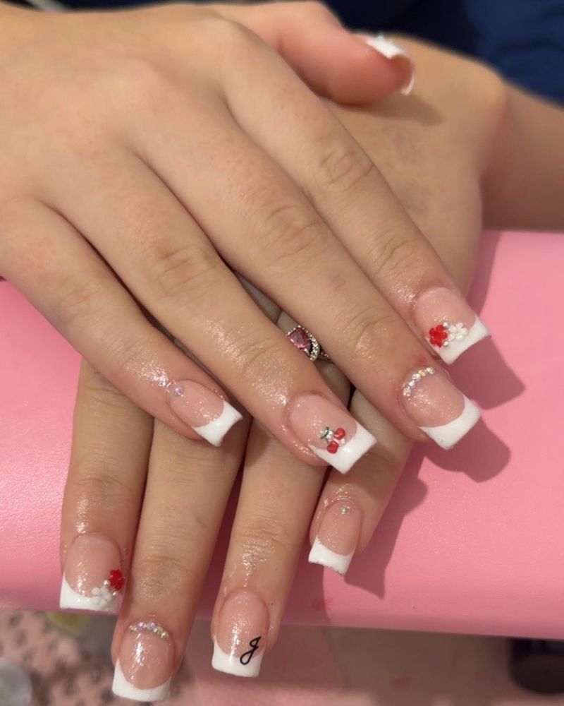 White French tips with cherry and flower charms